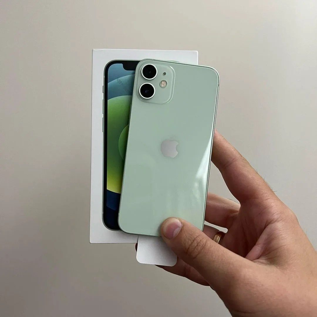 Green iPhone 12 mini with box in hand - Legacy Luxury Store Ghana