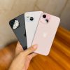 Three iPhone 15 colours held in hand showing camera design - Legacy Luxury Store Ghana