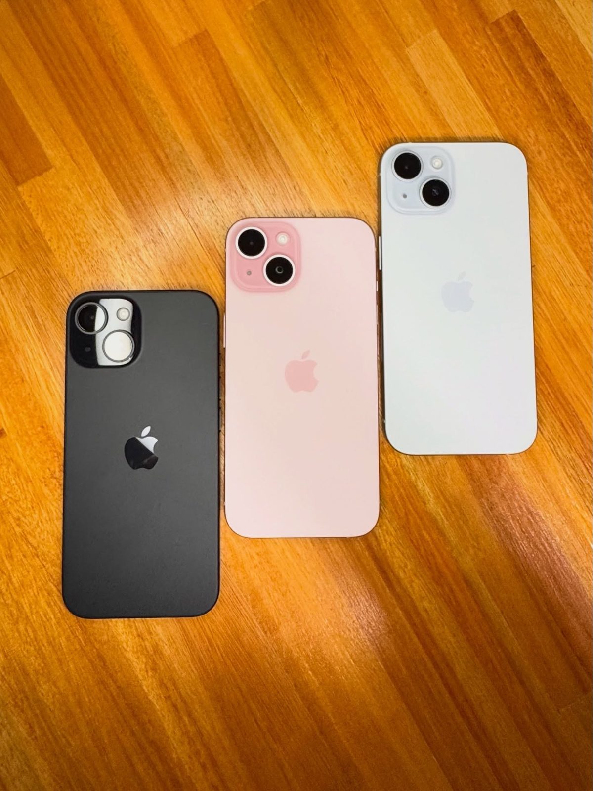 iPhone 15 black, pink and blue back view - Legacy Luxury Store Ghana
