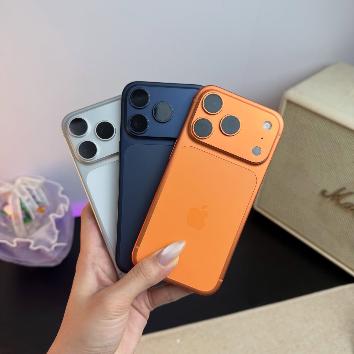 Orange, blue and white iPhone 17 Pro back view - Legacy Luxury Store Ghana